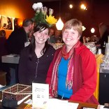 Sue and Nancy at the APK restaurant reception desk greeting event participants