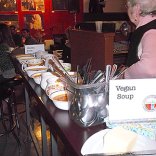 Bowls of Vegan soup set out for patrons selection